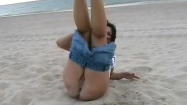 Beach babe Crystel Lei pissing pants and masturbating by the sea with naughty br